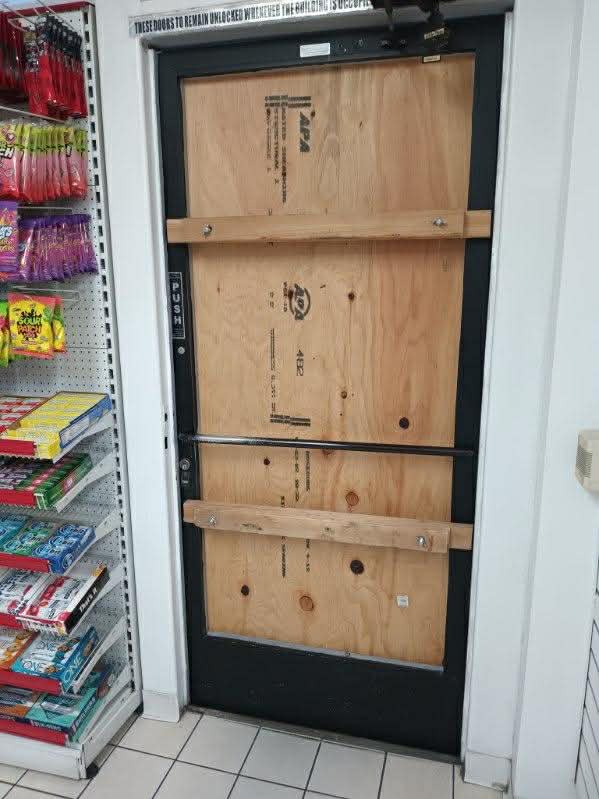 boarded up door in store